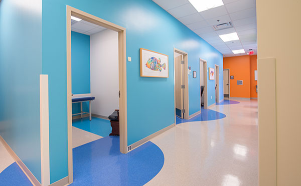 Hallway Showing Patient Rooms at Nemours Children's Urgent Care in Lake Nona, FL